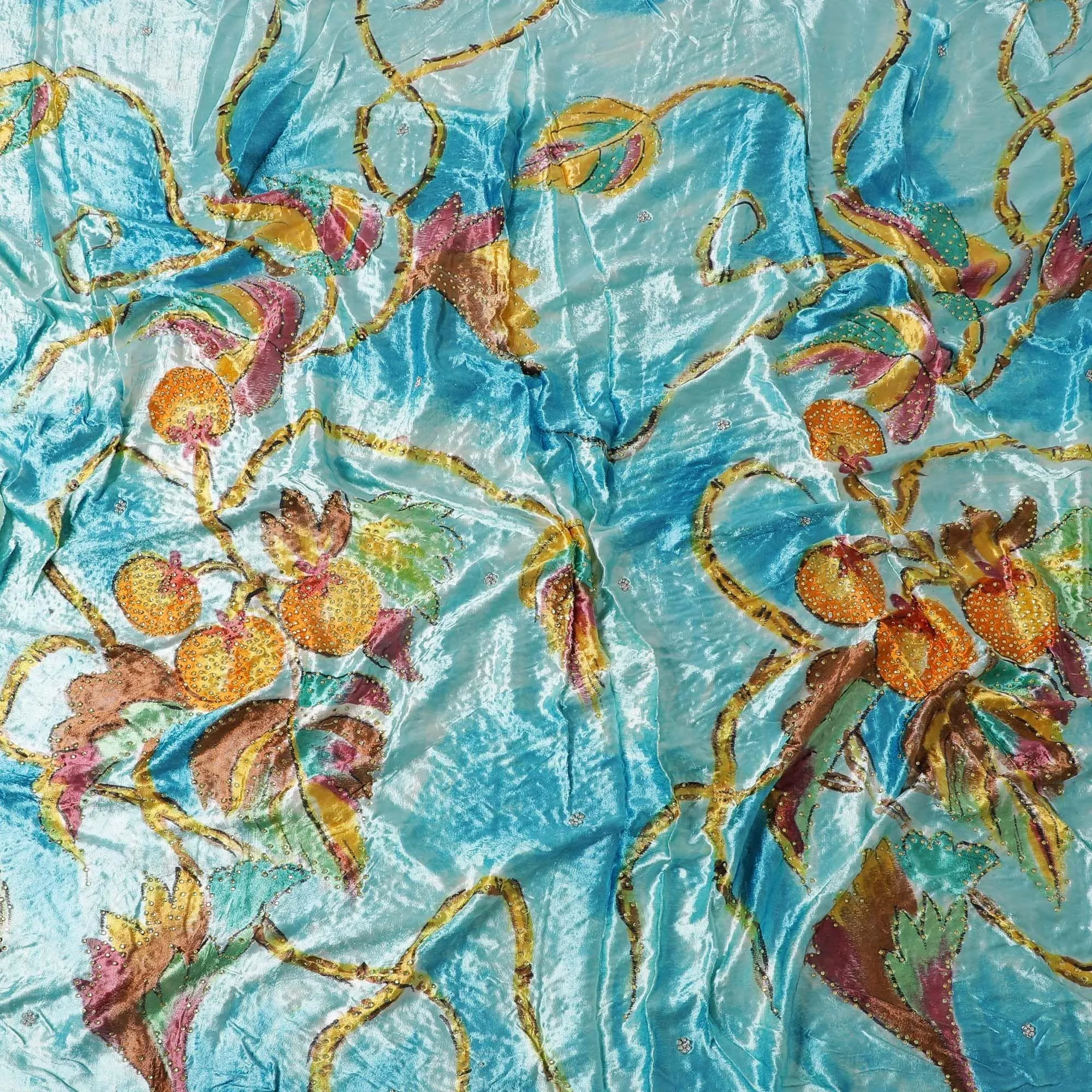 Arctic blue to sky blue Rayon velvet fabric with multicolor print having yellow and green stonework in leaf design