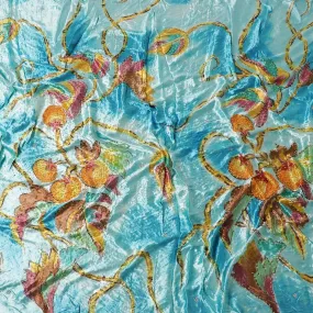 Arctic blue to sky blue Rayon velvet fabric with multicolor print having yellow and green stonework in leaf design