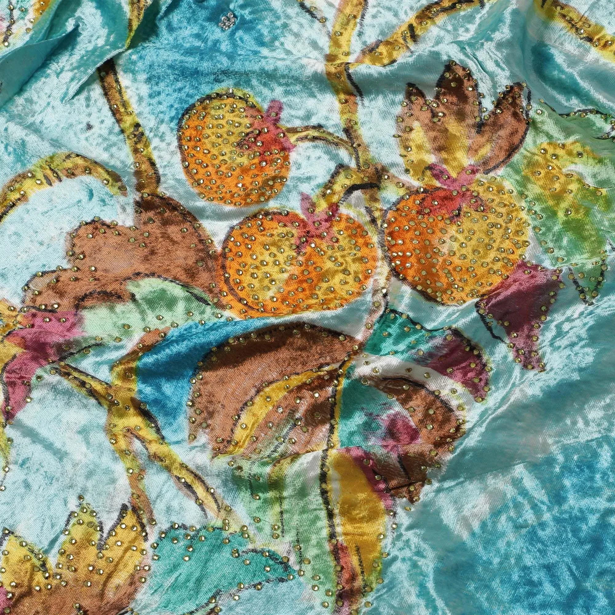 Arctic blue to sky blue Rayon velvet fabric with multicolor print having yellow and green stonework in leaf design